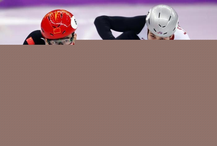 图为武大靖(红)在平昌冬奥会比赛中 图为武大靖(红)在平昌冬奥会比赛中